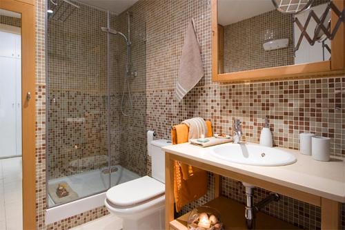 a bathroom with a sink and a toilet and a shower at Reina Amalia Apartment in Barcelona
