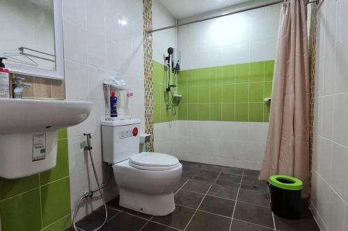 a bathroom with a toilet and a sink and a shower at KANA Homehug in Ban Nong Hin