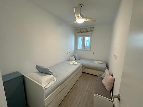 Posteľ alebo postele v izbe v ubytovaní Apartamento con jardín privado
