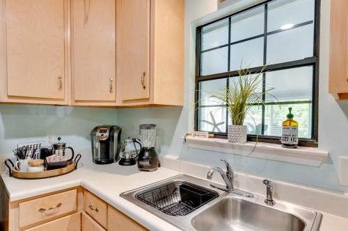 a kitchen with a sink and a window at Bright Navarre Vacation Rental, 2 Mi to Beach! in Navarre
