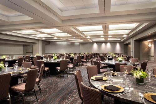 a large banquet room with tables and chairs at Crowne Plaza Atlanta Perimeter at Ravinia by IHG in Atlanta
