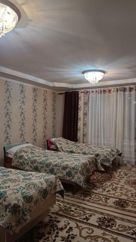 Ένα ή περισσότερα κρεβάτια σε δωμάτιο στο Aina guesthouse