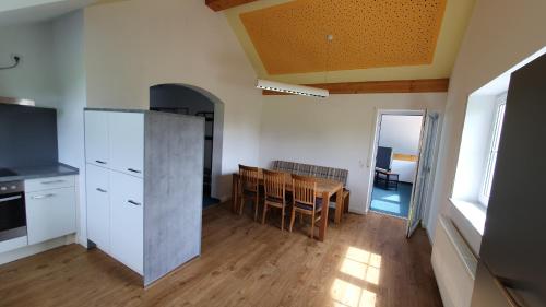 a kitchen and dining room with a table and chairs at Alpenblick in Leutkirch im Allgäu