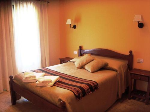 Ліжко або ліжка в номері Miralagos Apart & Cabañas