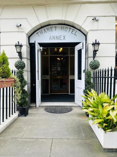 an entrance to a hotel with a sign that reads timer hotel amway at Thanet Hotel Annex in London