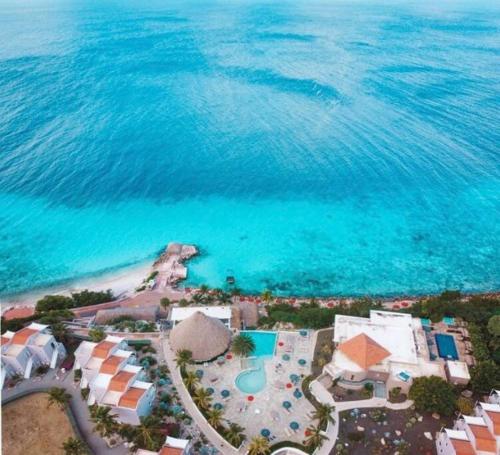 an aerial view of a resort and the ocean at VillaDelSol-Ocean Front Resort-Pool-up to 8 Guests-Walk to the Beach in Willibrordus