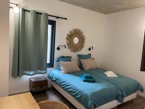 Posteľ alebo postele v izbe v ubytovaní A1 Magnifique appt 6 personnes Lofts de Ste Lucie