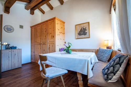 a living room with a table and a couch at Apartments Raphael in Ortisei
