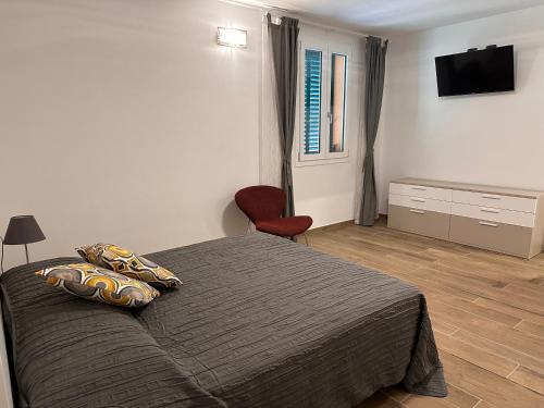 Una cama o camas en una habitación de IL FENICOTTERO