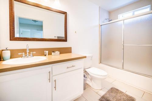 a bathroom with a toilet and a sink and a shower at Large Condo Sleeps 10 near Downtown Los Angeles in Los Angeles