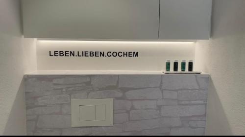 a sign that reads lebenelencocthen on a wall at Moselfreude in Cochem
