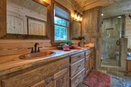 a bathroom with a sink and a shower at Sunset Ridge w Stunning 5 Star Views & Hot Tub in Blue Ridge