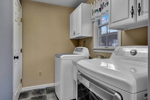 a kitchen with a washing machine and a sink at Chair Lift Lodge- Best Location in EVL Village! in Ellicottville