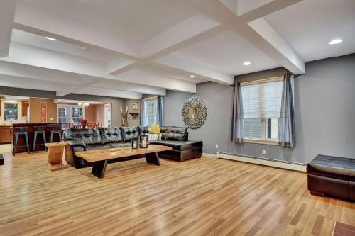 a living room with a couch and a table at Chair Lift Lodge- Best Location in EVL Village! in Ellicottville