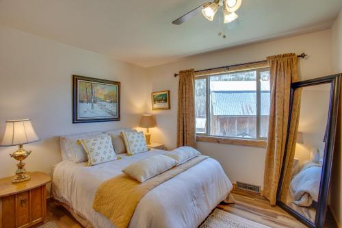 a bedroom with a bed and a large window at Cozy Dolores Getaway Hike, Fish and More! in Dolores