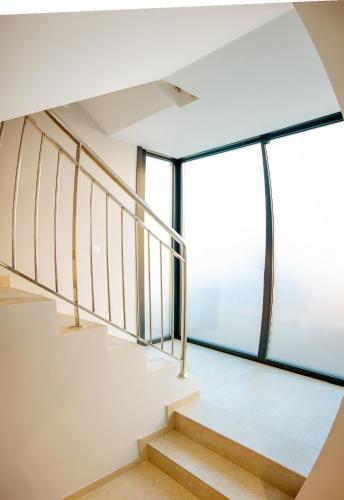 a staircase in a house with a window at Apartamentos Villa Zoila Nigrán in Nigrán