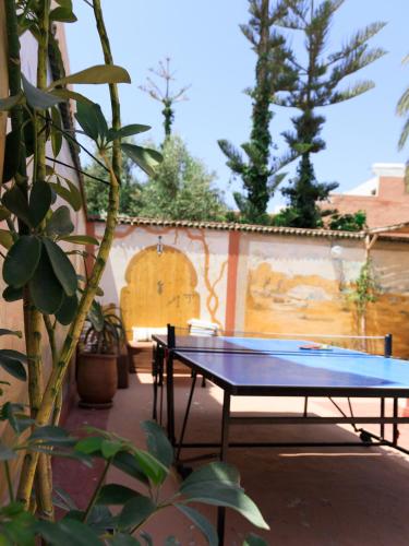 a ping pong table in the middle of a courtyard at Kasbari House in Taghazout