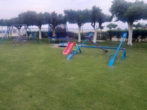 a group of playground equipment in a park at Hotel Thermaikos in Korinos