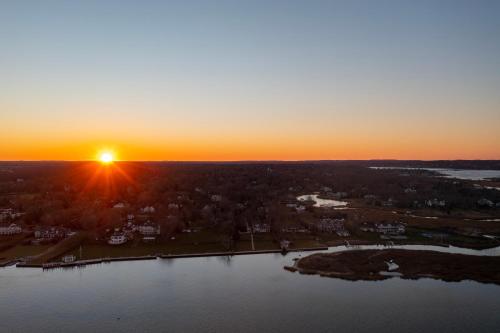 an aerial view of a sunset over a lake at BeachWalk at Sea Bright in Sea Bright