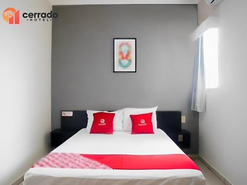 Ένα ή περισσότερα κρεβάτια σε δωμάτιο στο Cerrado Hotel LTDA