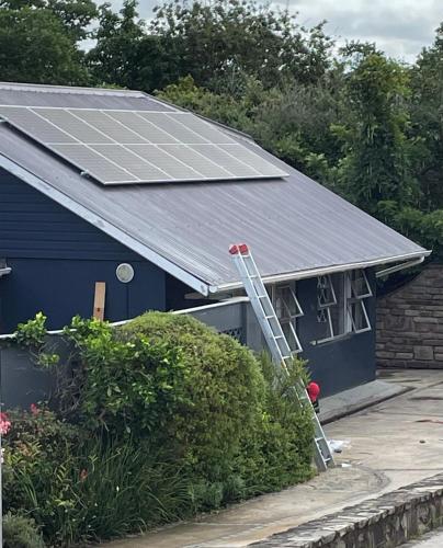 a house with solar panels on the roof at Wedmore Place with Solar in Grahamstown