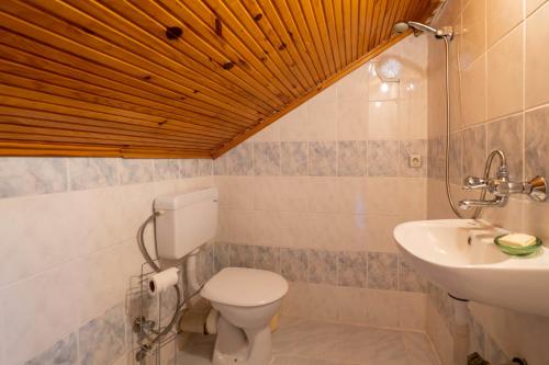 a bathroom with a toilet and a sink at Wonderful Home Close to Beach in Fethiye in Fethiye