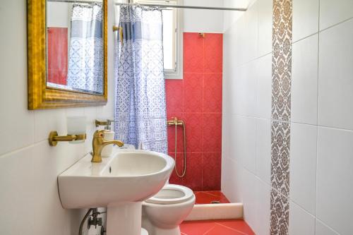 a bathroom with a sink and a toilet at ‘Sophie’s Villa’ in Naxos Chora