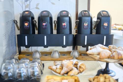 a bakery with a display of breads and pastries at Hotel Anna Siena Nord in Siena