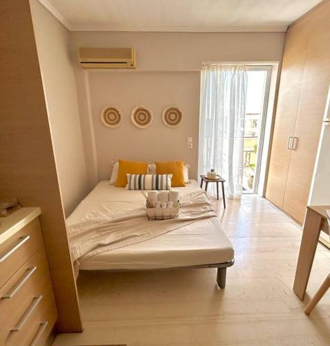 a bedroom with a bed in a room with a window at Lemon Tree Suite in Kos Town