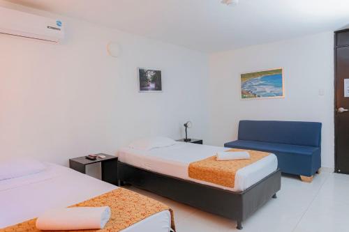 Letto o letti in una camera di Hotel Sol Inn Santa Marta