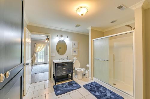 a bathroom with a shower and a sink and a toilet at Home with Private Pool - 15 miles to Ark Encounter! in Berry