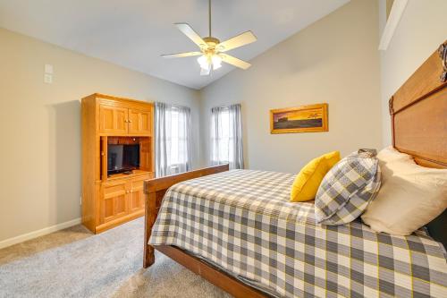 a bedroom with a bed and a ceiling fan at Home with Private Pool - 15 miles to Ark Encounter! in Berry