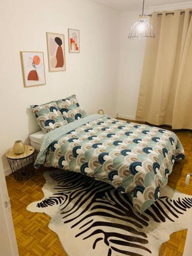 Кровать или кровати в номере Appartement centre ville