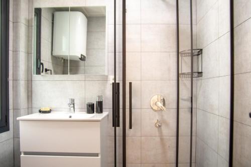 a bathroom with a sink and a shower at Lovely Villa with Private Pool in Alacati Cesme in Alacati
