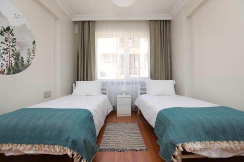 Cama ou camas em um quarto em Spacious and Central Flat in Sisli