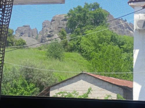a window with a view of a mountain at Kostis Hause in Kastrákion