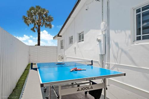 a ping pong table in front of a building at Perfect Location House in Miami Pool & Jacuzzi L43 in Miami