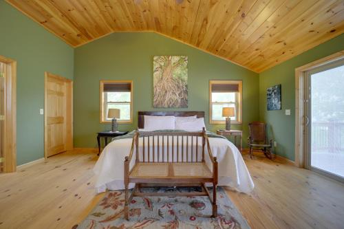 a bedroom with a bed and a wooden ceiling at Blue Ridge Mountain Cabin with Views, 2 Mi to Dtwn! in Murphy