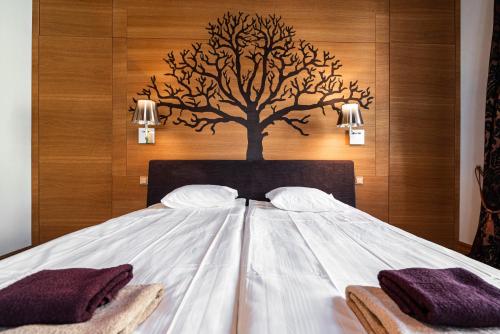 Postel nebo postele na pokoji v ubytování AirHome - Tree Spirit