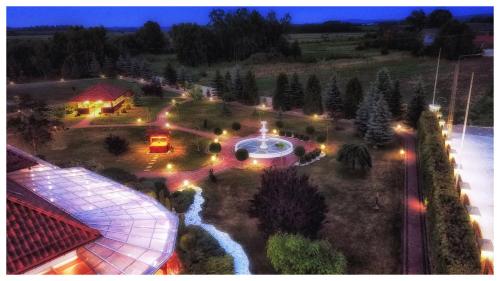 an aerial view of a house with a garden at night at Rezydencja Elżbiecin in Busko-Zdrój