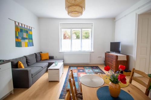 a living room with a couch and a table at Diófa Vendégház, Zebegény in Zebegény