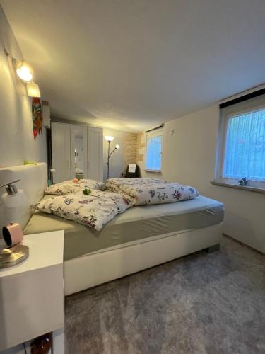 a bedroom with a large bed in a room at Haus Gisela in Thale