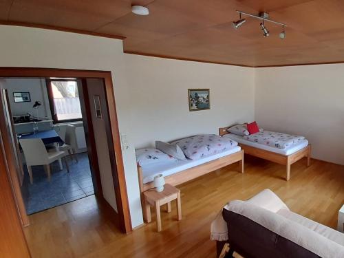 a living room with a bed and a couch at Büdingen-Ferienwohnung Bausch in Büdingen