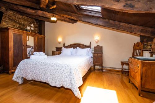 Katil atau katil-katil dalam bilik di Apartamentos Rurales Casa Riveras