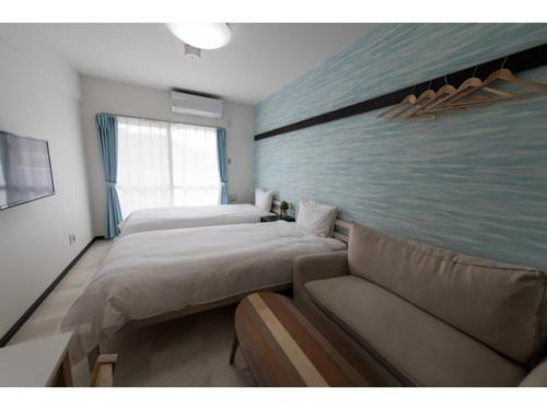 Ένα ή περισσότερα κρεβάτια σε δωμάτιο στο Hotel Thomas Nago - Vacation STAY 40485v
