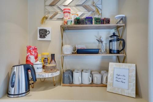 a shelf with cups and other items on it at Pet-Friendly Townhome with Hot Tub in Redmond! in Redmond