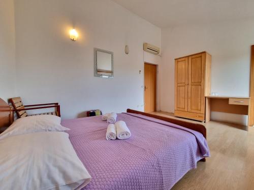 Кровать или кровати в номере Rooms Slavica Okrug Gornji