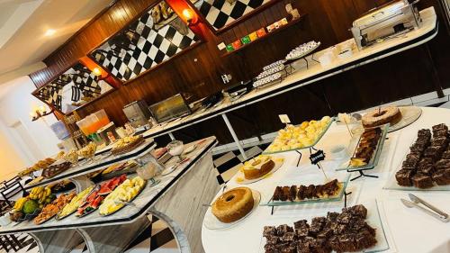 a buffet line with many different types of food at Atlântico Hotel in Santos