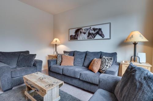 a living room with two couches and a table at Charming Redmond Townhome with Resort Amenities in Redmond