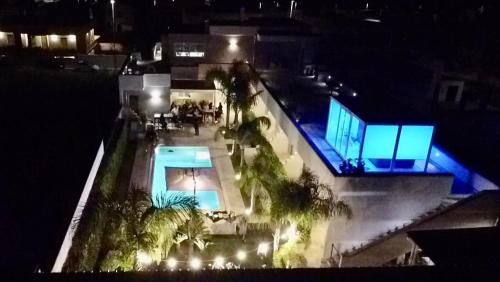 an overhead view of a swimming pool at night at Le Murge Del Salento Hotel b&b Depandance in Uggiano la Chiesa